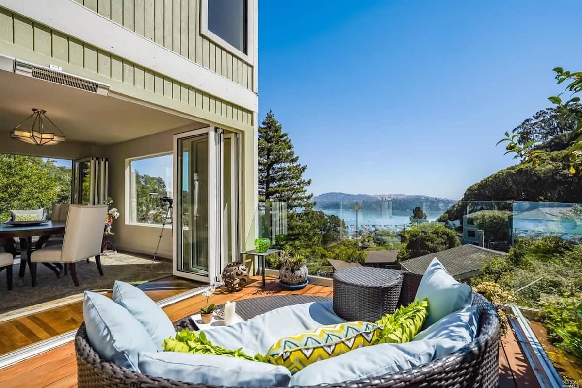 Three-level home exterior with panoramic harbor views