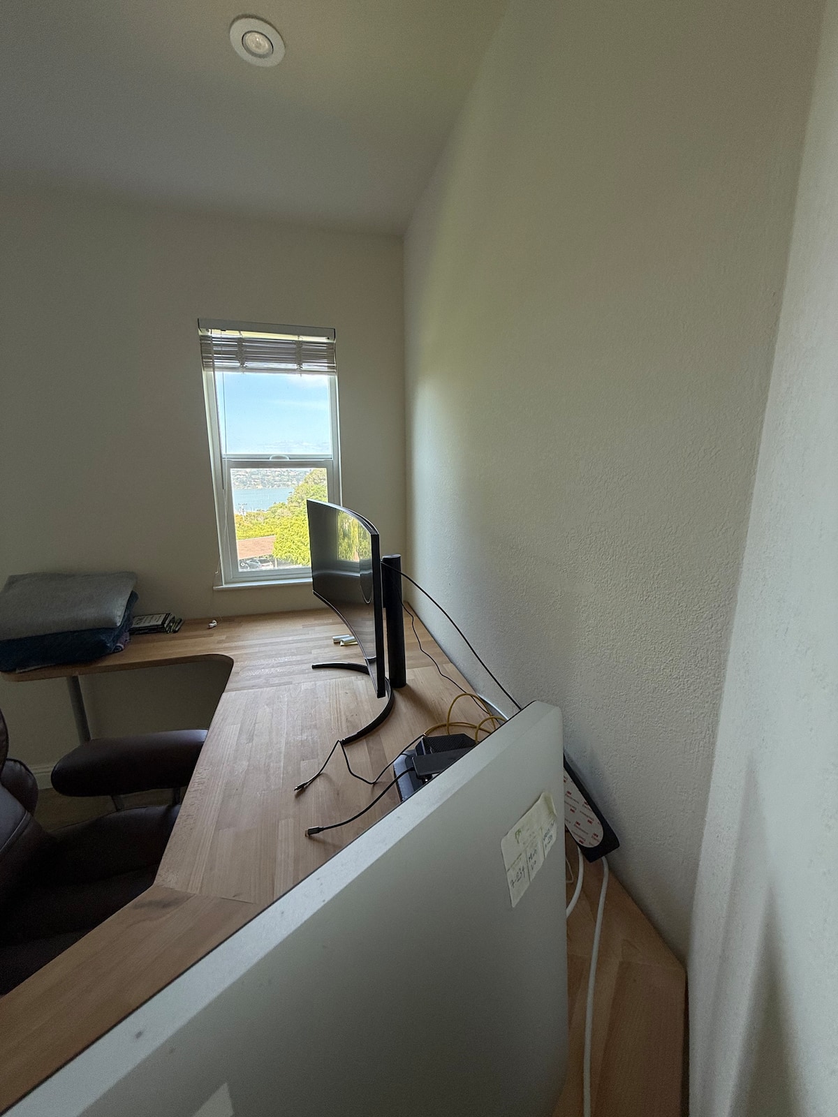 Dedicated office with dual ultrawide monitors and Bay views